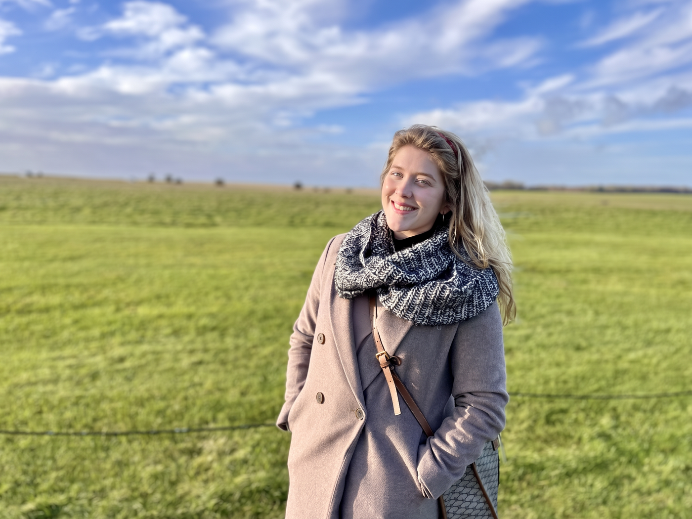Amanda outdoors in a green field